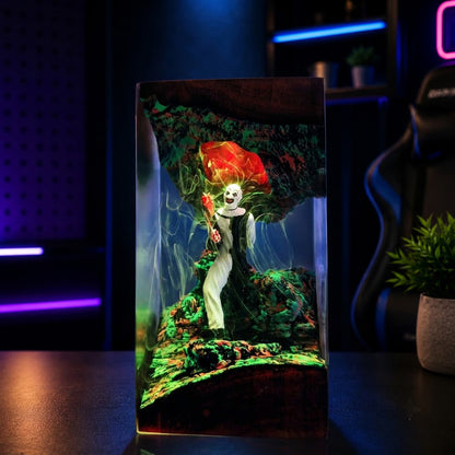 Angled view of handmade horror clown resin lamp with spooky LED lighting