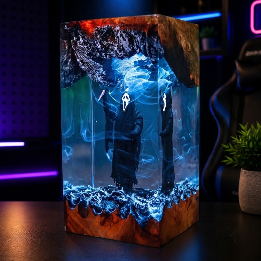 Side angle of a handcrafted masked slasher resin lamp with glowing LED lighting