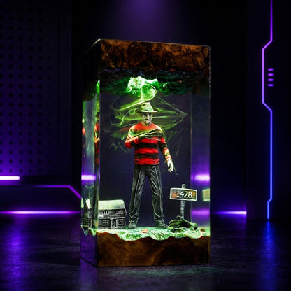 Nightmare-inspired epoxy resin lamp glowing on a wooden LED base with eerie handcrafted horror scenev